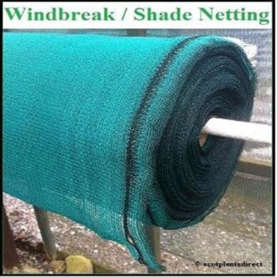A large roll of green windbreak or shade netting is mounted on a metal rod, ready for use in gardening or outdoor areas. The text above reads, “Windbreak / Shade Netting.”.